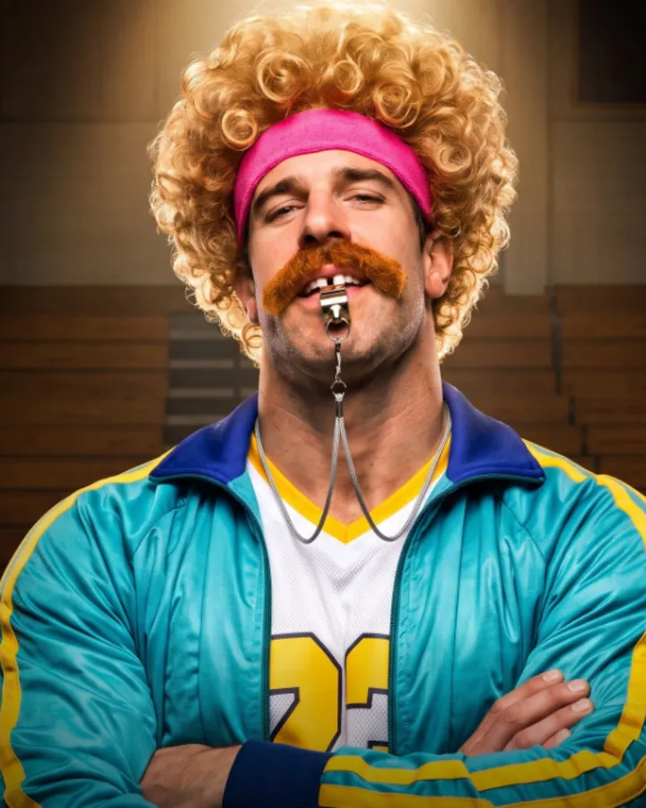 Mr. Gonner with a whistle and crossed arms.